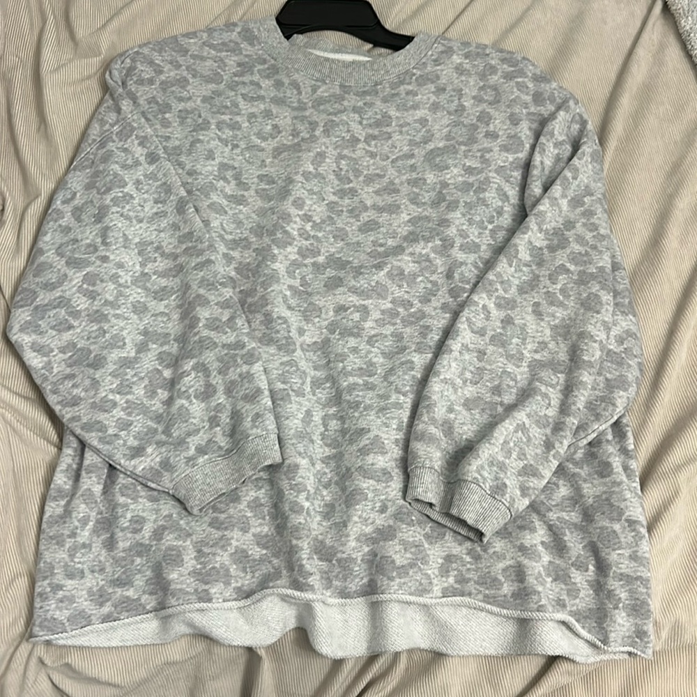 Cheetah print sweater. Sleeves are shorter and fits oversized.